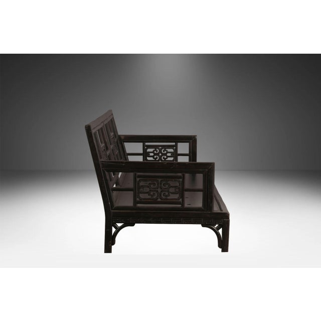 Elevate your space with this striking two-piece vintage Chinese fretwork sofa and Armchair seating suite. Expertly crafted...