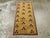 This Mid-20th century Turkish Art Deco throw rug, measuring 1' 7" x 3' 3", captures the refined elegance and experimental...