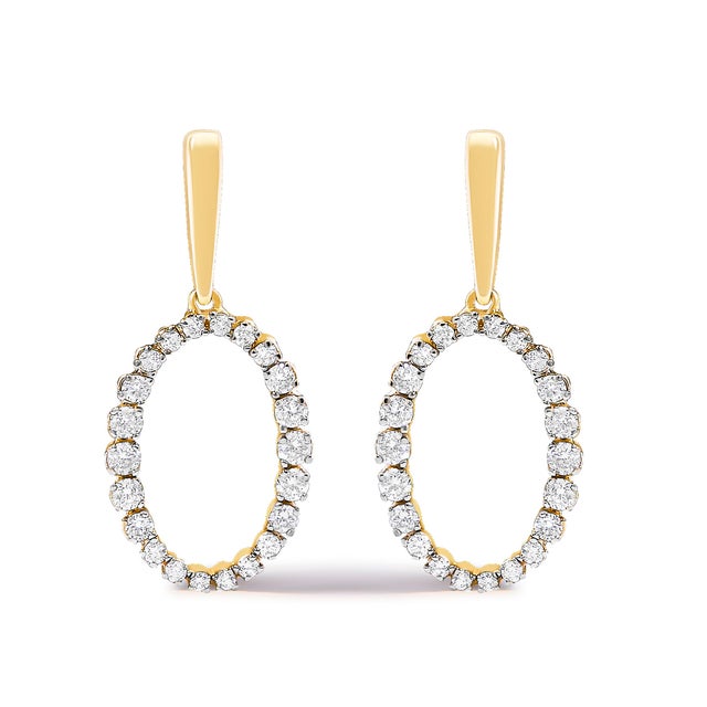 Crafted with impeccable elegance, these 14K yellow gold earrings feature a sublime oval dangle design, each caressed by a...
