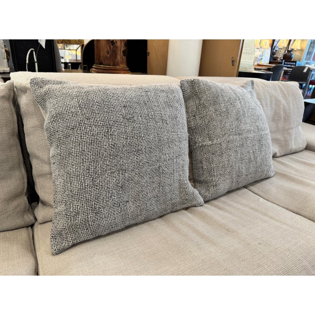 Design Plus Gallery presents a Pair of Faye Throw Pillows with Inserts from Pottery Barn. The pillows have a nubby black...