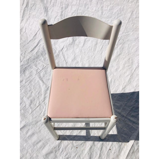 Vintage white painted , with pink vinyl seat chair 33"H X 17" W X 17"D , Makers mark reads Italy Conditions is very...