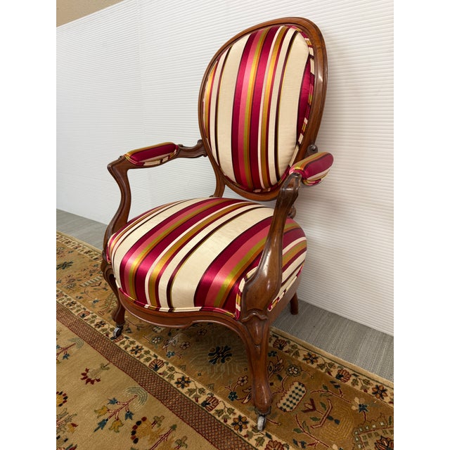 Design Plus Gallery presents an Antique Bergère Chair from the Late 19th Century. The chair is fashioned with exquisitely...