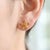 Bright, elegant, and inspired by nature, these Citrine Flower Stud Earrings are a beautiful expression of timeless style....