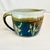 This is a beautifully executed Americana Folk Art Studio Pottery Pitcher. We love the color combination and the fact the...
