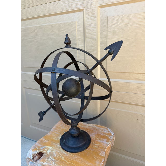 A beautifully crafted iron armillary sphere, evoking the timeless elegance of classical European gardens. Pieces like this...