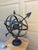 A beautifully crafted iron armillary sphere, evoking the timeless elegance of classical European gardens. Pieces like this...