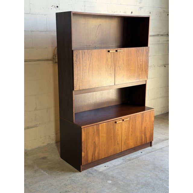 Beautiful vintage Danish Mid-Century Modern display cabinet crafted in richly figured rosewood veneer. This elegant...