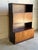 Beautiful vintage Danish Mid-Century Modern display cabinet crafted in richly figured rosewood veneer. This elegant...