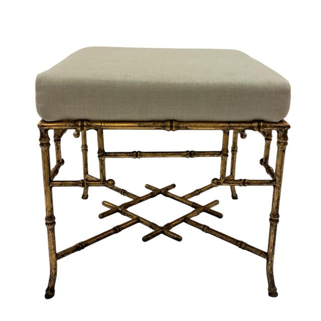 Benches inspired by the Hollywood Regency, composed of a structure of tubular bars of patinated gold metal in the shape of...