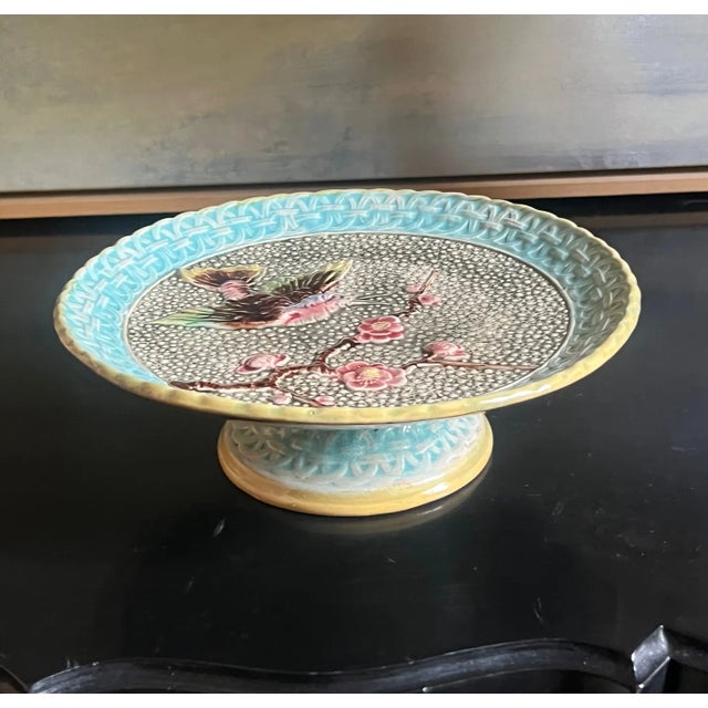 19th century majolica hand painted cake stand. The top has a bird and flowers surrounded in a blue lattice pattern with...