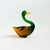 A vintage art glass mallard duck. Beautiful coloring to the glass that fades from green at the head to an amber-brown...