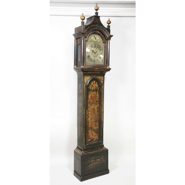 Arched bonnet with three wood finials over a glazed arched door enclosing a brass dial signed Benjamin Sudlon , Yarmouth ,...