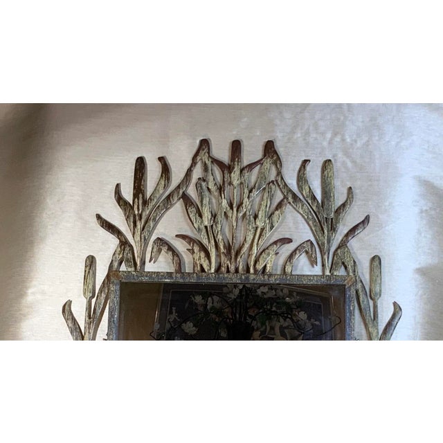 Exceptional mirror made of iron, unusual cat tail motif beautifully enhanced patina treated for rust. Beautiful object of...
