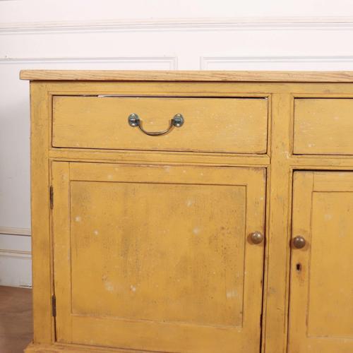 Early 19th Century English country house dresser base with a scrubbed pine top. 1820 This piece is designed in the style...