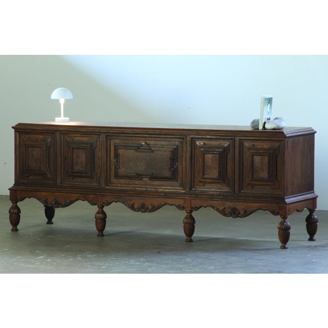 Large Danish sideboard crafted in dark stained oak, combining traditional cabinetmaking with clean architectural lines....