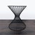 Upgrade your space with this modern accent table, featuring a unique hourglass wire frame design and a smooth, round top....