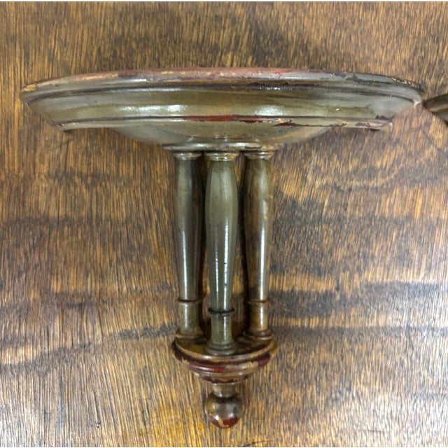This is a gorgeous matching pair of vintage wooden wall shelves featuring turned spindle supports and dark stained finish....