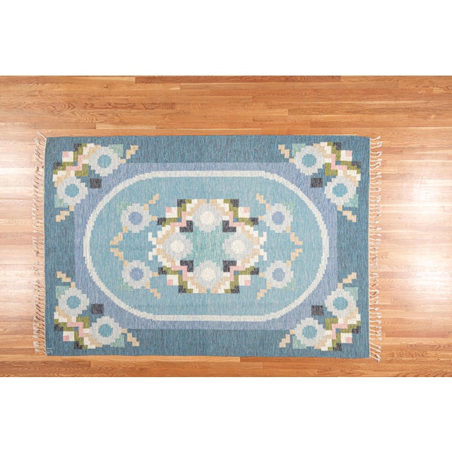 A beautifully designed Swedish Flatweave from the 1960s, distinguished by a highly balanced geometric-floral composition....