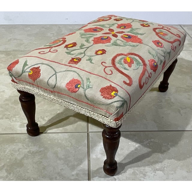 exquisite, hand-embroidered antique footstool. This piece seamlessly blends traditional craftsmanship with timeless...