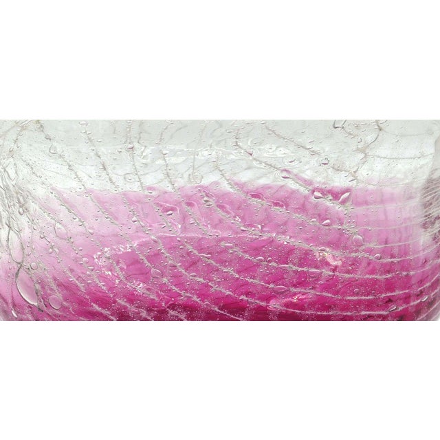 This is a wonderful original color-changing glass bowl, veined of variations of magenta, and realized in the first half of...