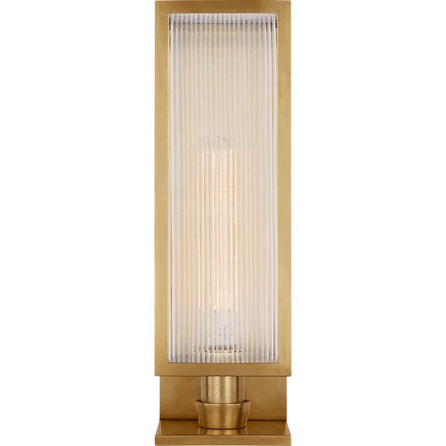 York 16" Single Box Sconce in Soft Brass with Clear Ribbed Glass Designer: Barbara Barry Finish: Soft Brass Height: 16.25"...