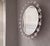 Large mid century melted ice effect illuminated circular wall mirror / wall light dating from about 1970. Beveled mirror.