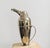 A silver plated cocktail shaker in the shape of a penguin made by Restoration Hardware in the 1990s. It was part of a...