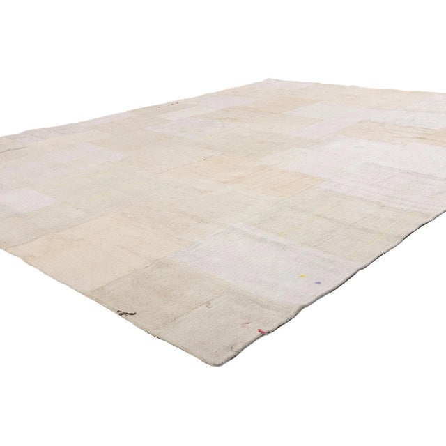 53528 Vintage Turkish Patchwork Kilim Rug, 09'02 x 12'00. A tableau of forgotten silences and sun-washed time, this...