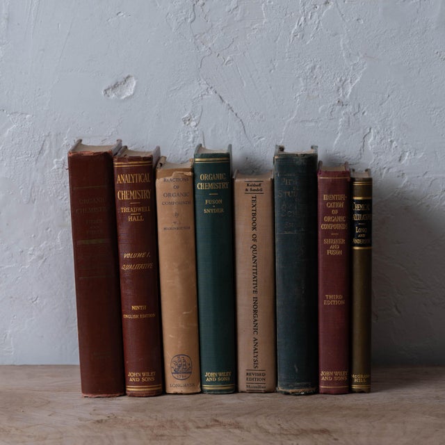 A group of 1940s chemistry books. on shelf: 11 inches wide by 6 ½ inches deep by 9 ½ inches tall