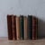 A group of 1940s chemistry books. on shelf: 11 inches wide by 6 ½ inches deep by 9 ½ inches tall