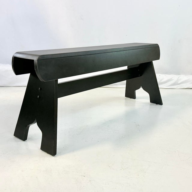 This is a vintage bench in the Amish Style. The lines are simple and yet chic. There is a support rail under the bench...