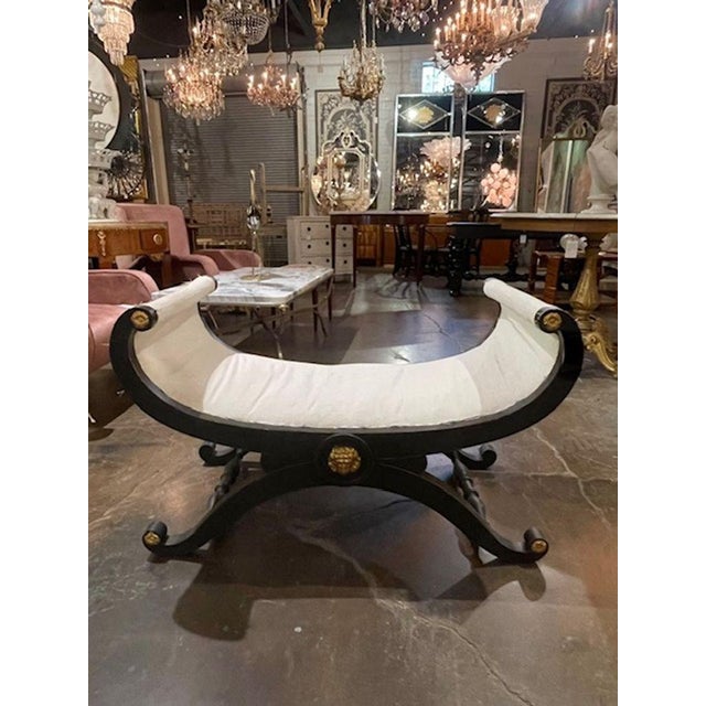 The Vintage Italian Neoclassical Painted Window Bench is a unique and stylish piece of furniture that can add a touch of...