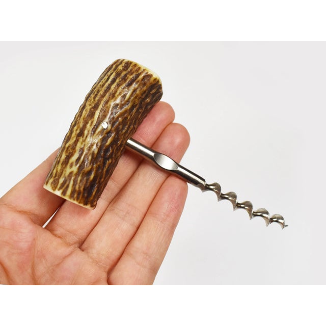 This is a natural antler handle wine bottle opener with metal screw. Great piece to display on bar, on your drink cart,...