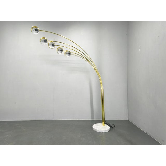 Exceptional Danish mid century arc floor lamp produced by Bilka in the 1970s. This elegant and highly decorative piece...