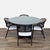 Round solid wood dining table with glass protective top and four Aimee Armchairs with a softly curved back, rattan caning,...