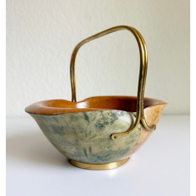 Exquisite craftsmanship in this vintage, circa 1960s, basket or handled bowl produced by Macabo Cusano and designed by...