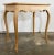 Vintage French Louis XV style bleached wood side table with carved apron and turned legs. Reminiscent of 19th C. Hand-...