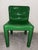 Model 4875 chair in green plastic. The backrest and seat are rounded. The legs are round. Produced by Kartell in 1970 and...