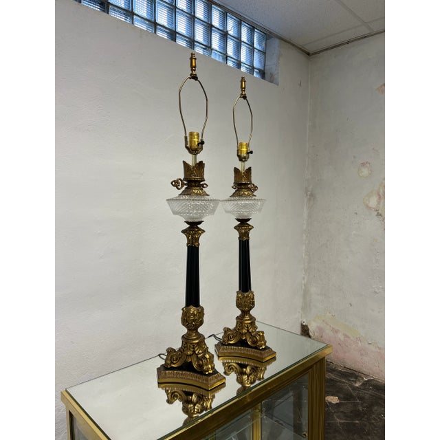 Beautiful Empire style lamps. Cut glass or pressed glass oil reservoirs with flame tops and key detail. 3 portraits adorn...