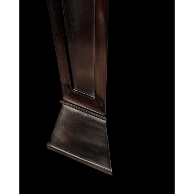 A magnificent side table in solid black lacquered oak, adorned with a stunning marquetry star crafted from thin sheets of...