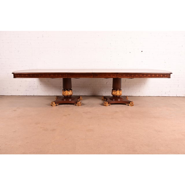 An outstanding Italian Neoclassical or Regency style monumental extension dining table In the manner of Karges Furniture...