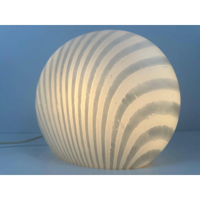 Vintage table lamp by Peill & Putzler. Glass in excellent condition. Organic design (shell). Zebra stripes for a playful...