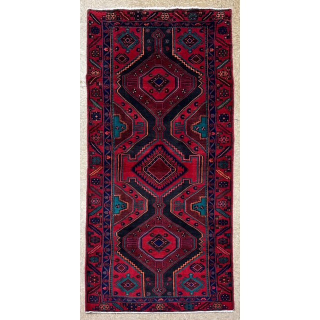 Antique hand-knotted runner from the Meshkin Shahr region of northwest Iran, featuring a series of large, angular...
