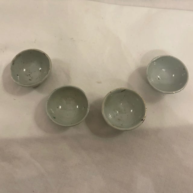 Set of 4 miniature Chinese pottery hand painted handmade bowls. Famille Rose colors, Sake flowers. These look great in the...