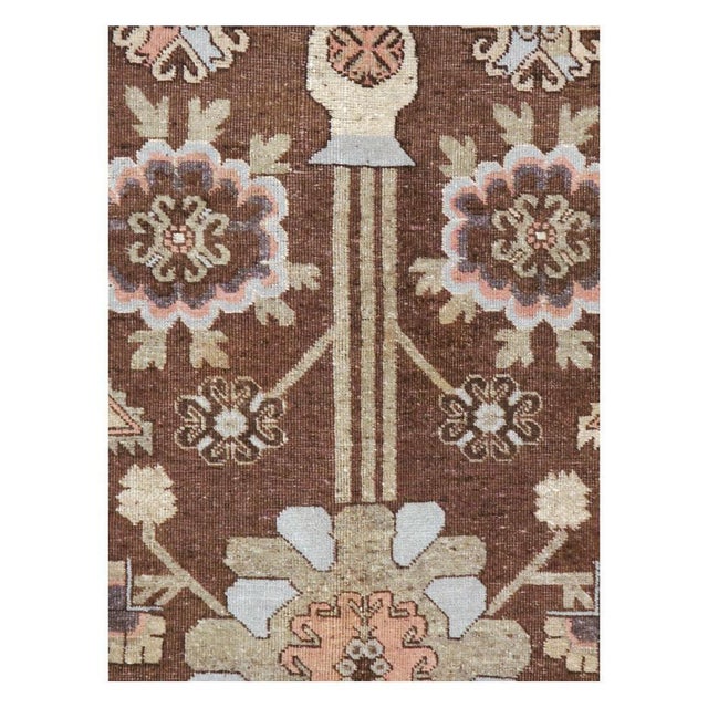 An antique East Turkestan Khotan accent rug in gallery format handmade during the early 20th century. Measures: 5' 2" x 9'...