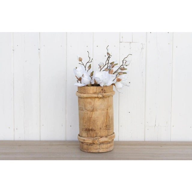 A vintage wood and bamboo container with a tall round shape. This Asian water bucket has a clean bleached finish with...