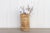 A vintage wood and bamboo container with a tall round shape. This Asian water bucket has a clean bleached finish with...