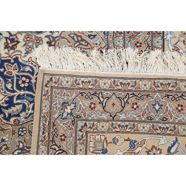 Beautiful hand-knotted Nain rug made from wool and silk. Nain is a small village located in central Persia that has...