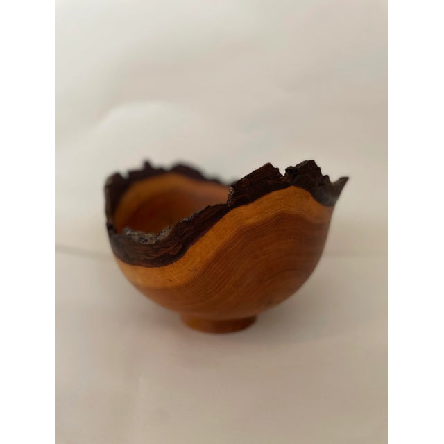 Hand turned asymmetrical butternut walnut wood live edge bowl, signed.
