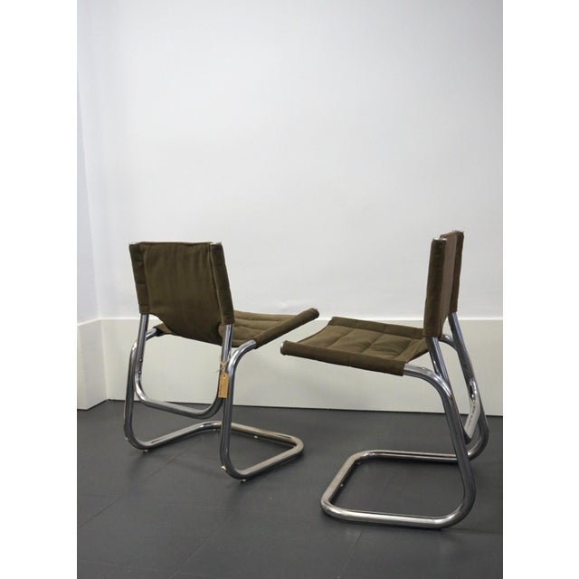 Set of 4 space age chairs in curved and chromed steel, design from the 70s. New upholstery.